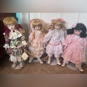 3 Heritage Mint Collection porcelian dolls and one antique heritage doll
